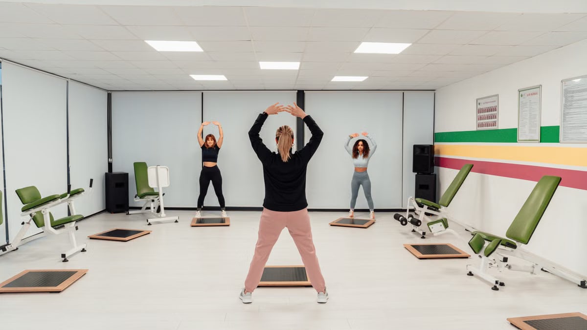 Group of women practicing pilates in an indoor gym in Yalova, Türkiye, promoting a healthy lifestyle.